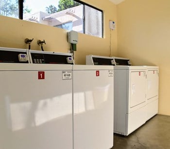 community laundry room with washers and dryers